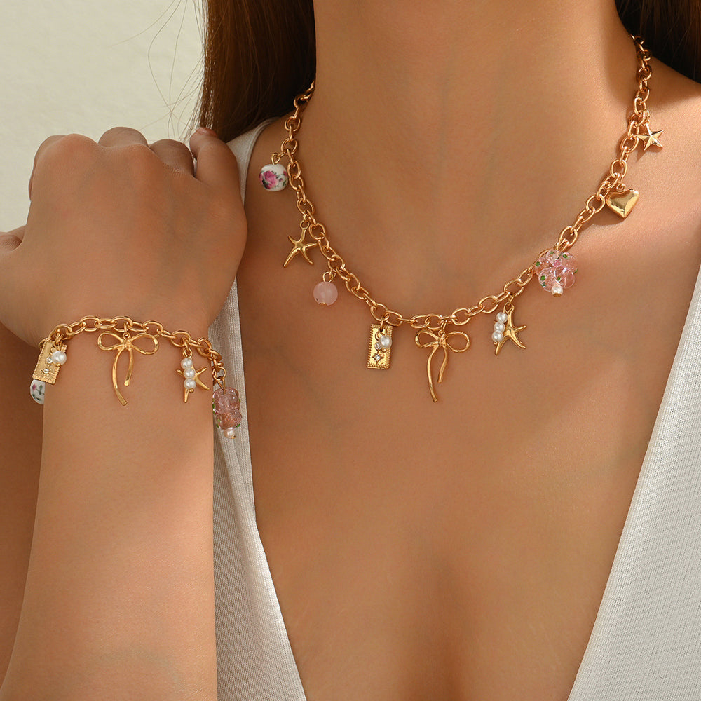 Wholesale bowknot necklaces, cross-border new floral heart pendants, women's niche high-end ceramic bead bracelet accessories