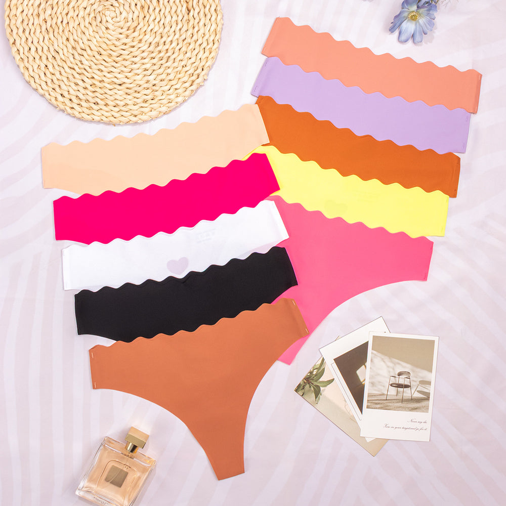 personalized one-piece seamless women's underwear pure color cut out wavy waist low-waist nylon adhesive underwear for women