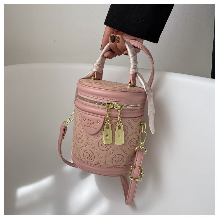 Solid color texture small bag women's autumn 2025 new trendy fashion niche portable round bucket bag popular messenger bag