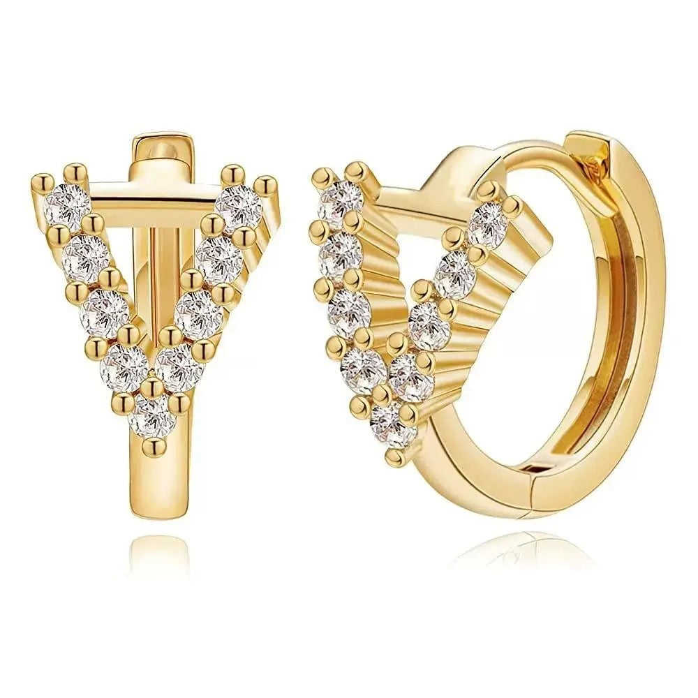 European and american jewelry: ear cuffs, diamond-studded small hoop earrings, stud earrings, and ear bone rings