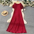 French-inspired pleated, waist-cinching, slimming dress for women. red, tie-waist, elegant, and flowy maxi dress, perfect for the office