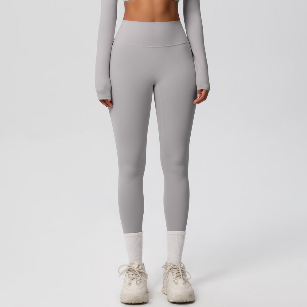 High-waisted, brushed nylon yoga pants with a cloud-like feel, designed for outdoor sports. these compression leggings are quick-drying and perfect for running and fitness. custom manufacturing available