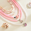 Wholesale pink shell necklace - european and american style, beach vacation vibe, fashionable beaded starfish pearl layered necklace for women