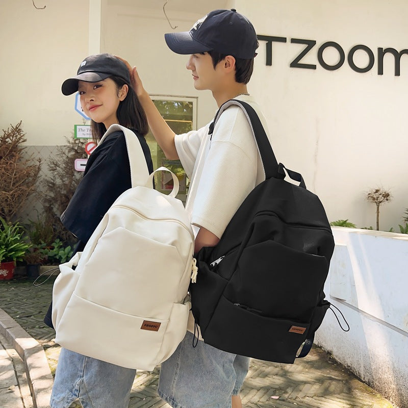 New solid color junior high school student large-capacity backpack male backpack schoolbag male college student business travel backpack