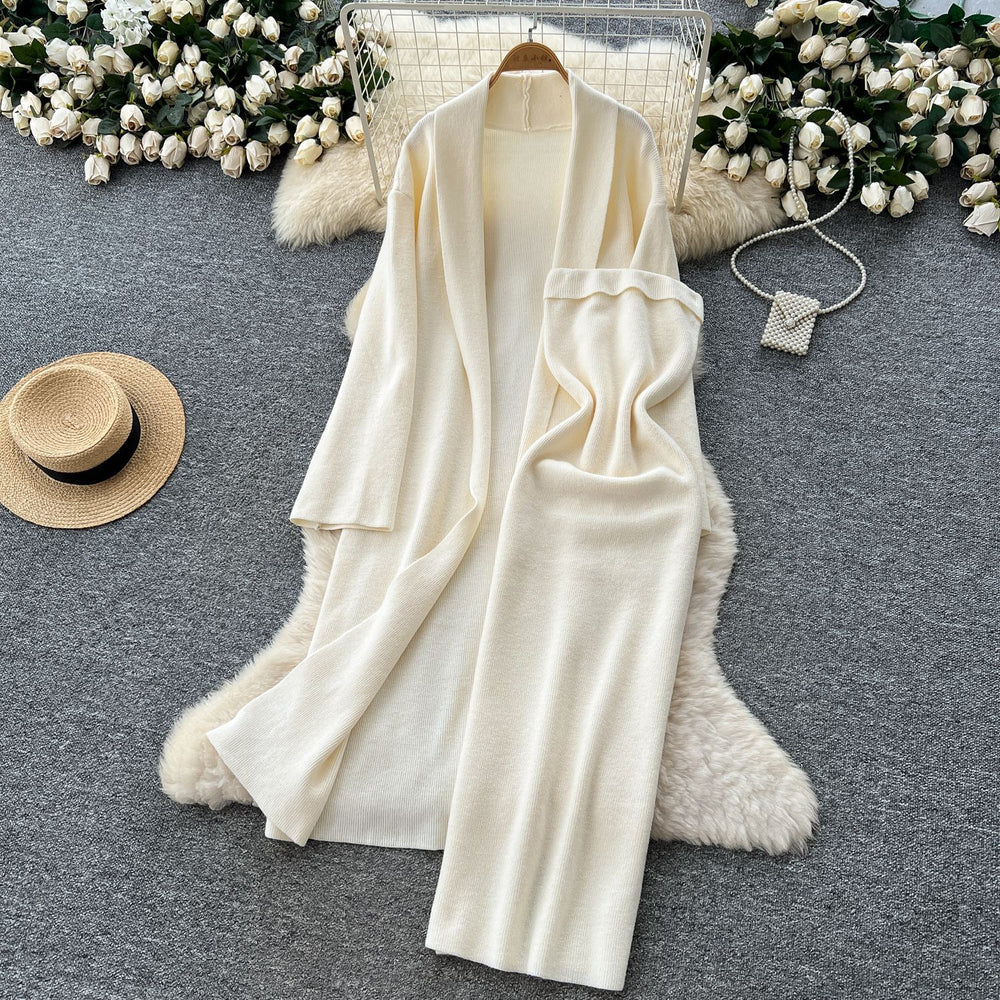 Minimalist solid color knitted mature woman's winter set: slim-fit bandeau dress with long cardigan coat