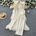 Minimalist solid color knitted mature woman's winter set: slim-fit bandeau dress with long cardigan coat