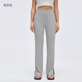 Sand-washed ribbed yoga pants for women, loose-fitting, with a flattering drape and slimming effect. wide-leg, slightly flared, with a slit detail. perfect for sports and fitness. style d26024