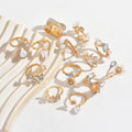 Vintage-inspired floral ring set - 13 piece collection. unique, high-end, and versatile. features faux pearls and diamond accents