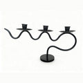 European retro minimalist wavy iron candle holder with electronic candles for a romantic ambiance in living room or dining table