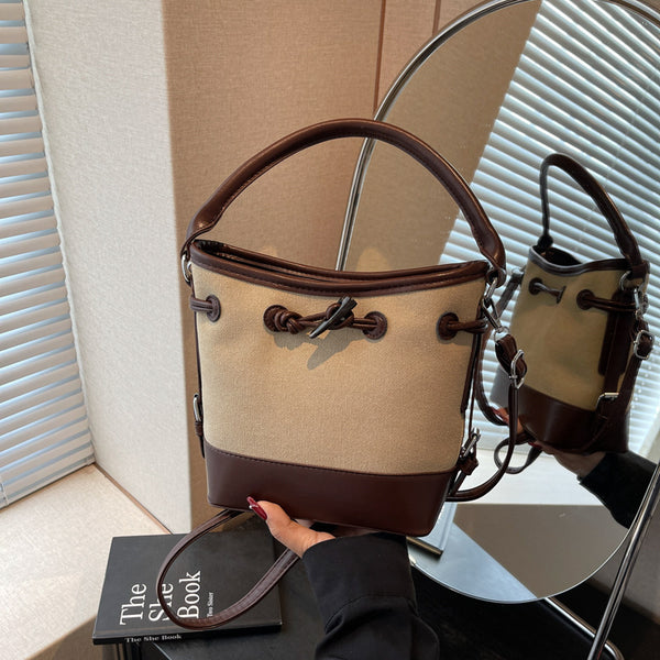 Premium sense simple retro bucket bag women's 2025 summer new messenger bag casual foreign style portable shoulder bag