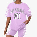 Girls' t-shirt and shorts set featuring a cartoon short-sleeve design and printed graphics, perfect for casual streetwear