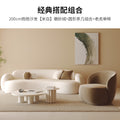 Curved, uniquely shaped, cream-toned sofa – a creative and sophisticated addition to clothing stores, beauty salons, office break rooms, and reception areas