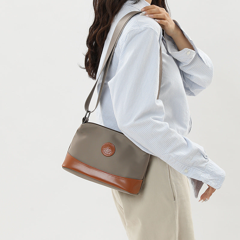 Cross-border color contrast trend women's bags, new casual and light commuting Oxford cloth shoulder bag, three-layer large-capacity messenger bag
