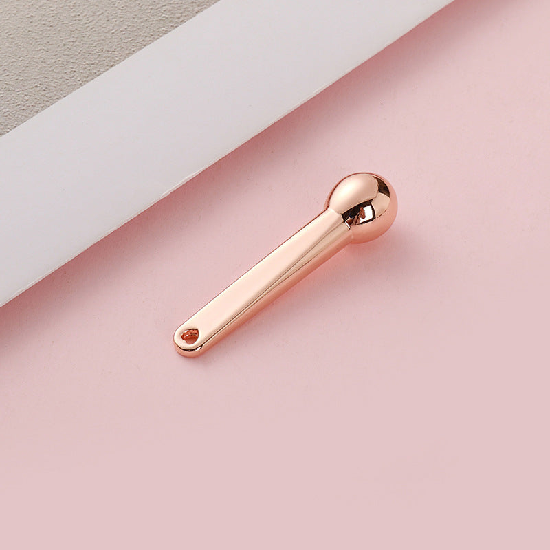 Manufacturer's small hammer dispensing stick, exquisite cosmetics digging metal eye cream massage stick, eye beauty stick