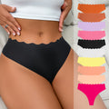 European and american  low-waist seamless ice silk underwear one-piece adhesive pure color cut out wavy waist women's underwear