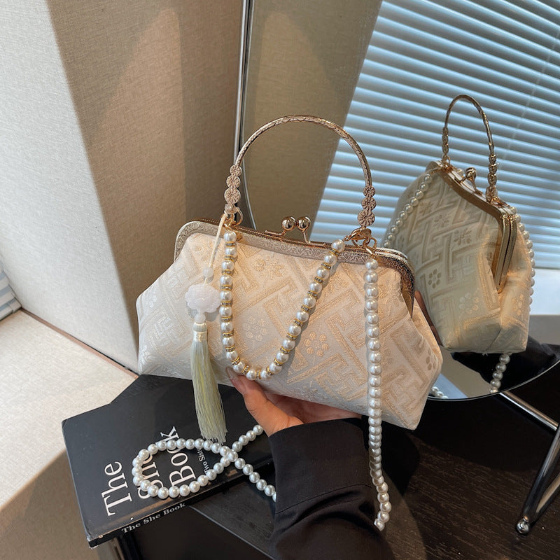 Cross-border new Chinese style national style hand bag women's summer 2025 new niche messenger bag Korean version popular mouth gold bag