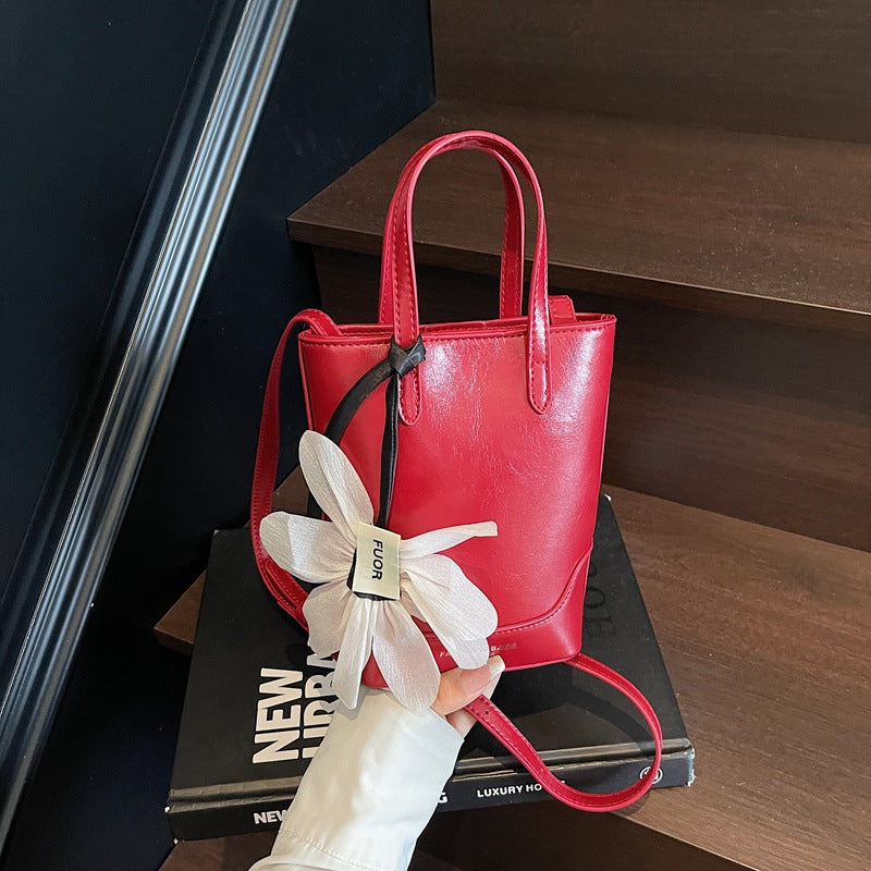Cross-border exquisite flower mobile phone bag 2025 new women's summer trend popular bucket bag premium texture messenger bag