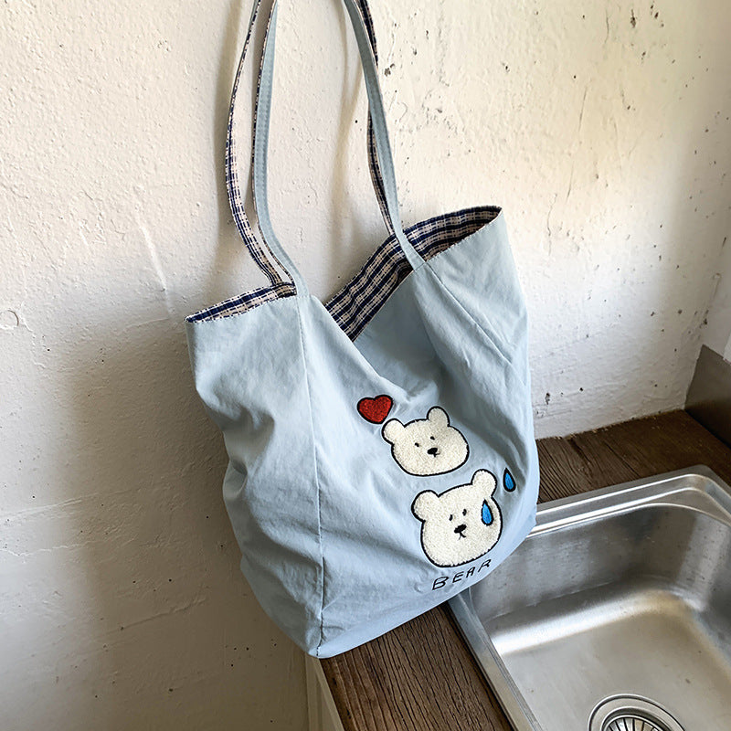 Canvas bag 2025 new women's handheld cloth bag large capacity carrying book bag junior high school students tutoring embroidered shoulder bag