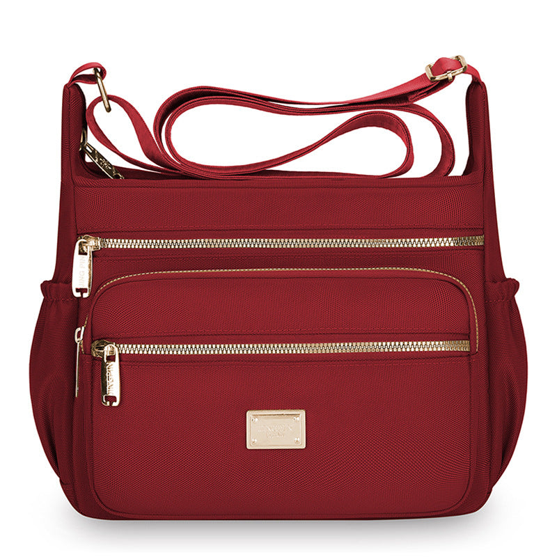 Women's bags are fashionable and simple, large-capacity messenger bags, multi-layer storage, travel shoulder bags, going out for commuting, middle-aged mother bags.