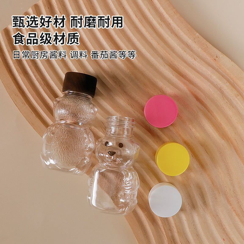 hot seller: bear-shaped clear pp plastic bottles with lids - perfect for juice, drinks, sauces, and honey. airtight sealing