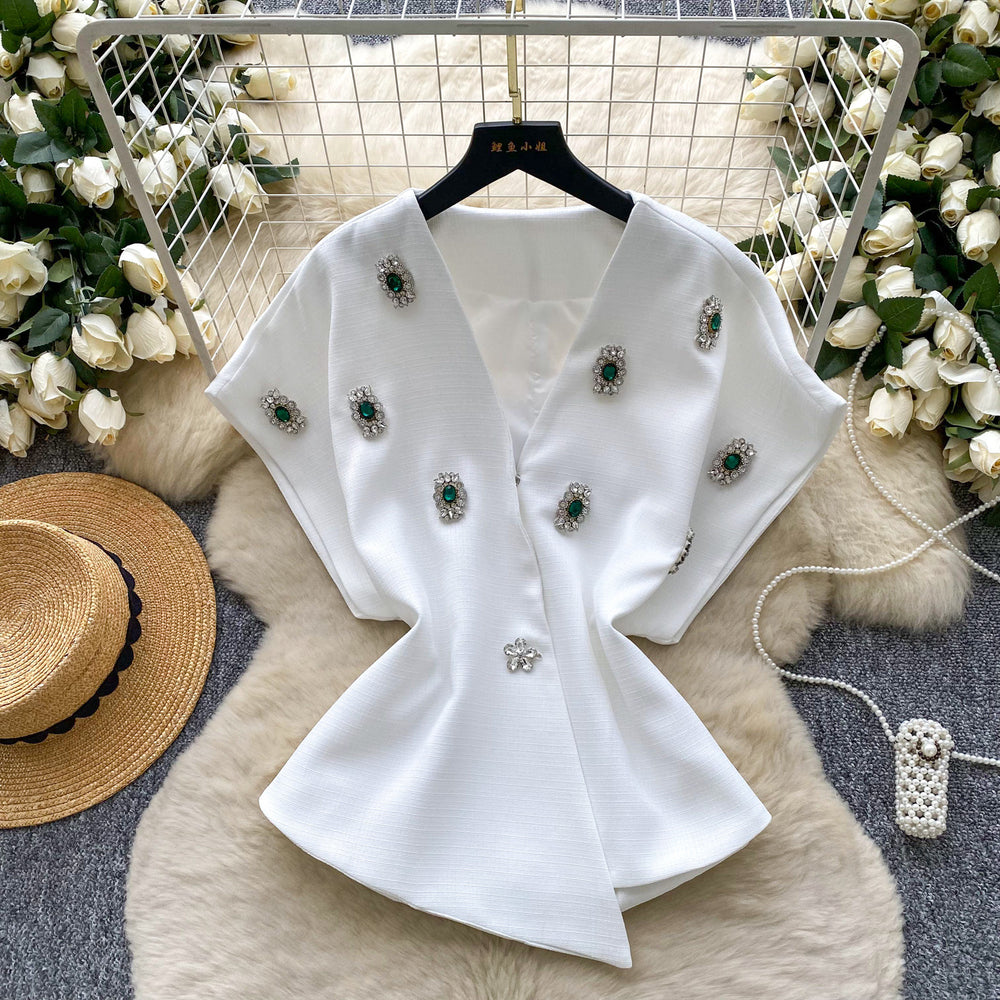 Elegant chanel-inspired, high-end, meticulously crafted, diamond-studded v-neck, short-sleeved, waist-cinching jacket for women. a chic and sophisticated french-style blazer vest, perfect for winter