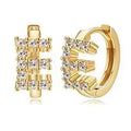 European and american jewelry: ear cuffs, diamond-studded small hoop earrings, stud earrings, and ear bone rings