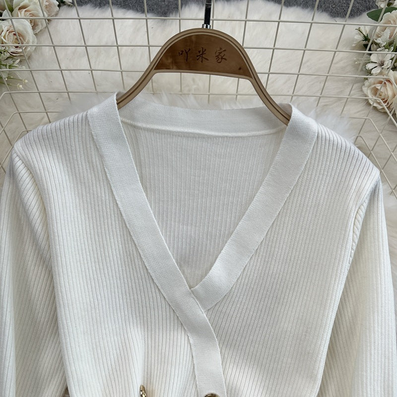Elegant chanel-inspired v-neck double-breasted knit dress with cinched waist – a chic and sophisticated layering piece for spring and autumn