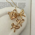 European and american cross-border ins style high-end bow pendant necklace for women, elegant and versatile minimalist earrings and rings jewelry set