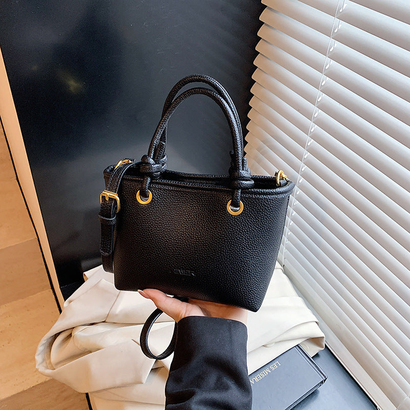 Foreign trade advanced sense hand carrying bucket bag 2025 summer simple and versatile shoulder bag trendy niche design messenger bag