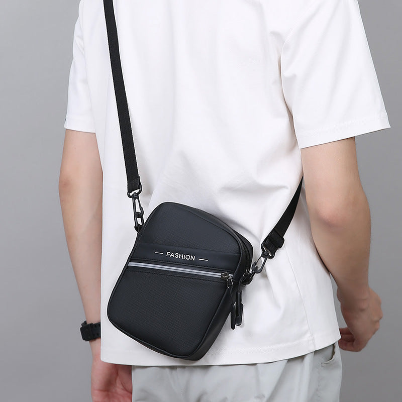 Simple casual men's shoulder bag outdoor travel portable mobile phone bag PU leather film lightweight versatile messenger bag wholesale