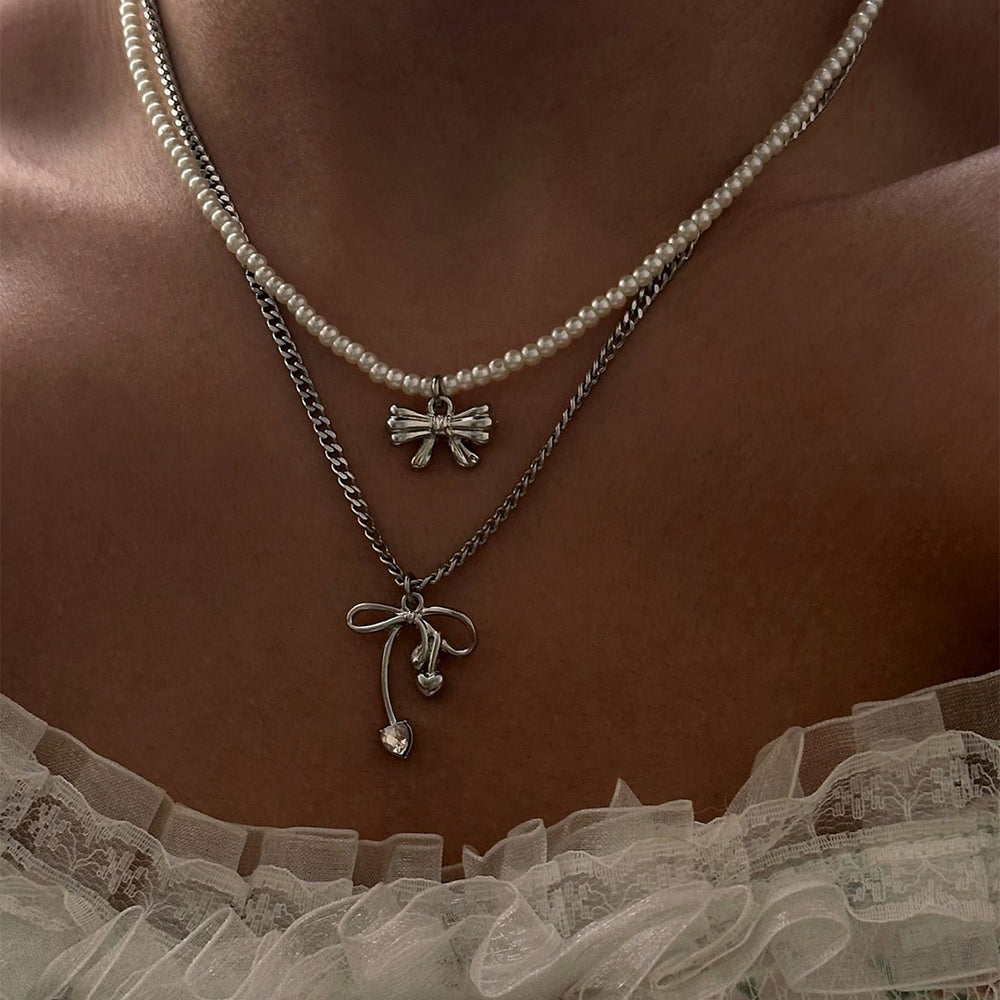 Sweater chain long wholesale european and american cross-border autumn and winter bow pendant stacking simple accessible luxury niche pearl necklace