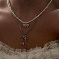 Sweater chain long wholesale european and american cross-border autumn and winter bow pendant stacking simple accessible luxury niche pearl necklace