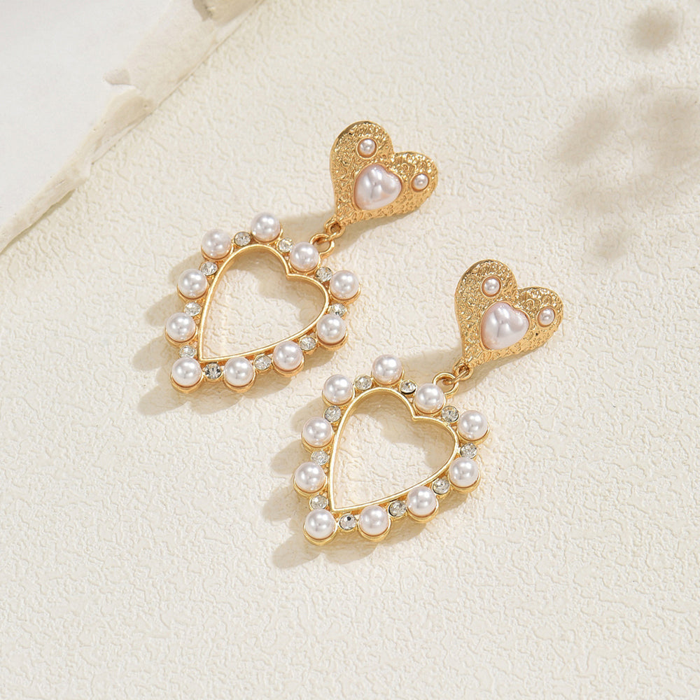 European and american cross-border casual sweet heart pearl earrings - light luxury, high-end, elegant, versatile, hollow heart stud earrings for women