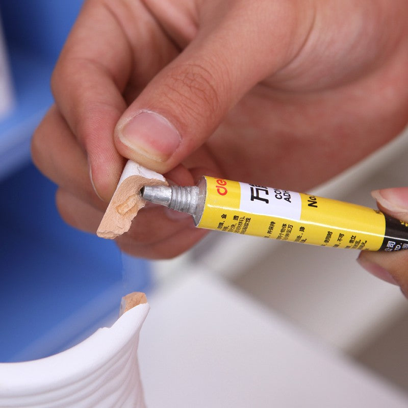 Deli stationery 71.40 million glue 7ml sticky leather wood metal glass porcelain fixed glue wholesale