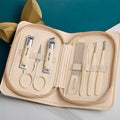 Stainless steel manicure & pedicure tool set - 9 piece kit: includes nail clippers, eyebrow scissors, earwax removal tool, and nail file - wholesale