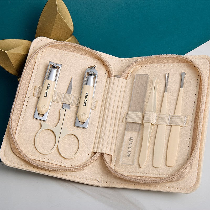 Stainless steel manicure & pedicure tool set - 9 piece kit: includes nail clippers, eyebrow scissors, earwax removal tool, and nail file - wholesale