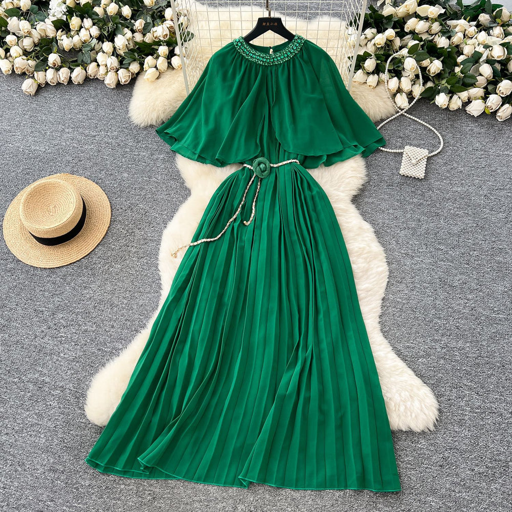 French-style, heavily embellished, beaded and rhinestone-studded, round-neck shawl dress with tie-waist detailing. features a flattering, slimming silhouette and elegant pleated chiffon