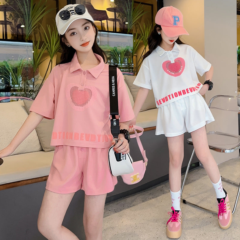 new girls' summer outfit set: stylish and trendy, perfect for older girls. summer-inspired short-sleeve and shorts set with heart-themed polo shirt – a popular choice for kids' summer fashion