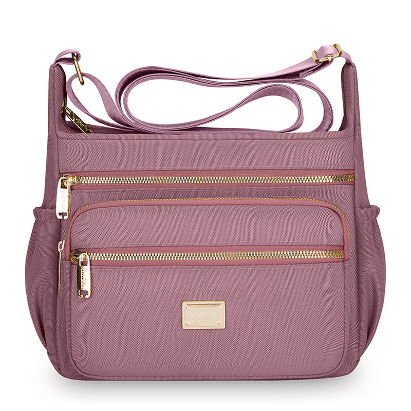 Women's bags are fashionable and simple, large-capacity messenger bags, multi-layer storage, travel shoulder bags, going out for commuting, middle-aged mother bags.