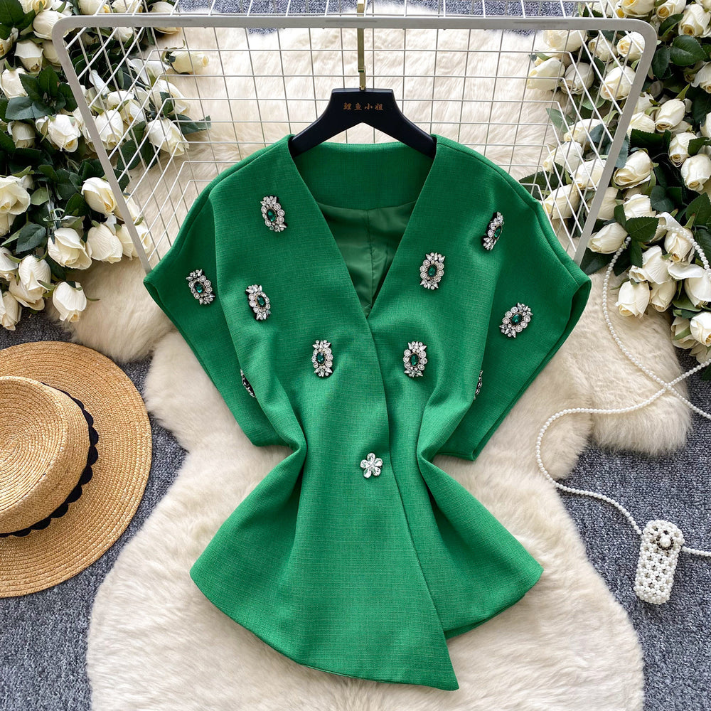 Elegant chanel-inspired, high-end, meticulously crafted, diamond-studded v-neck, short-sleeved, waist-cinching jacket for women. a chic and sophisticated french-style blazer vest, perfect for winter