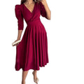 fashion women's clothing:  spring collection - solid color v-neck, cinched waist, pleated maxi dress
