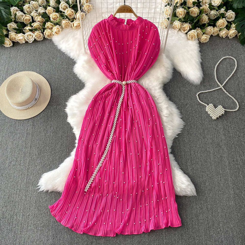 Elegant and sophisticated, this heavy-beaded, ruffled-edge, round-neck dress is a stunning new addition to your summer wardrobe. designed to flatter, it features a cinched waist and a slimming silhouette, finished with a pleated maxi skirt