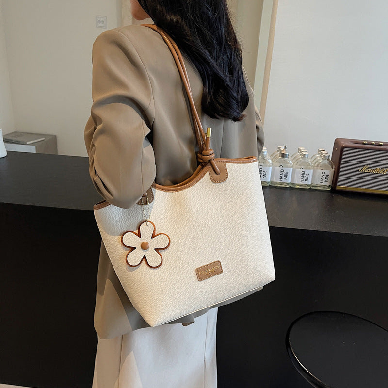 Hand carry versatile bucket bag women's bag 2025 new fashion texture shoulder bag casual foreign style messenger bag