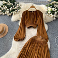 French style women's autumn outfit: elegant cinched-waist cropped lantern sleeve blouse with high-waisted, flowy slit midi skirt two-piece set