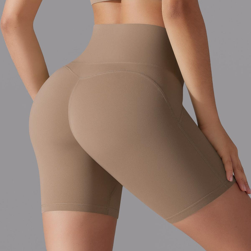 Naked-feel, high-waisted, butt-lifting yoga shorts – perfect for running, fitness, and a custom-made, three-quarter length fit. sampling and oem manufacturing available