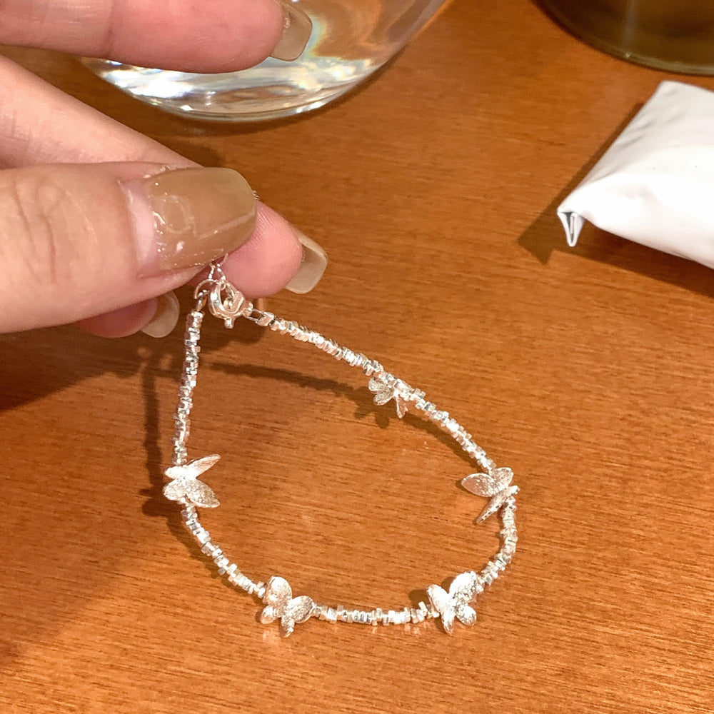 Elegant butterfly bracelet with crushed silver beads - 2026 new arrival, light luxury, niche design, exquisite and high-end style, wholesale for women
