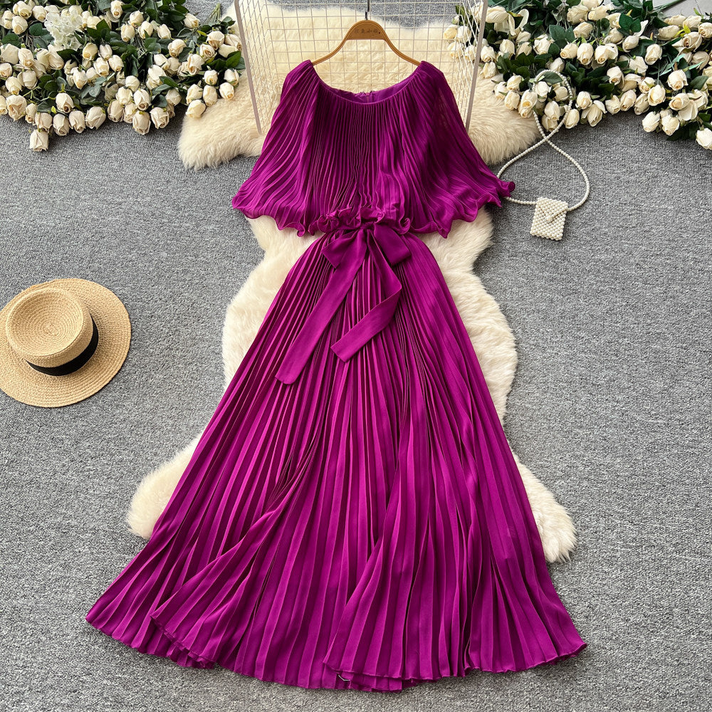 French-inspired pleated dress for women, featuring a bow tie, off-the-shoulder design, tie-waist, and flattering pleats for an elegant and sophisticated look