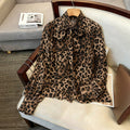 Luxury leopard print blouse with tie-waist, stand collar, and lantern sleeves - elegant workwear for women, 1688 source