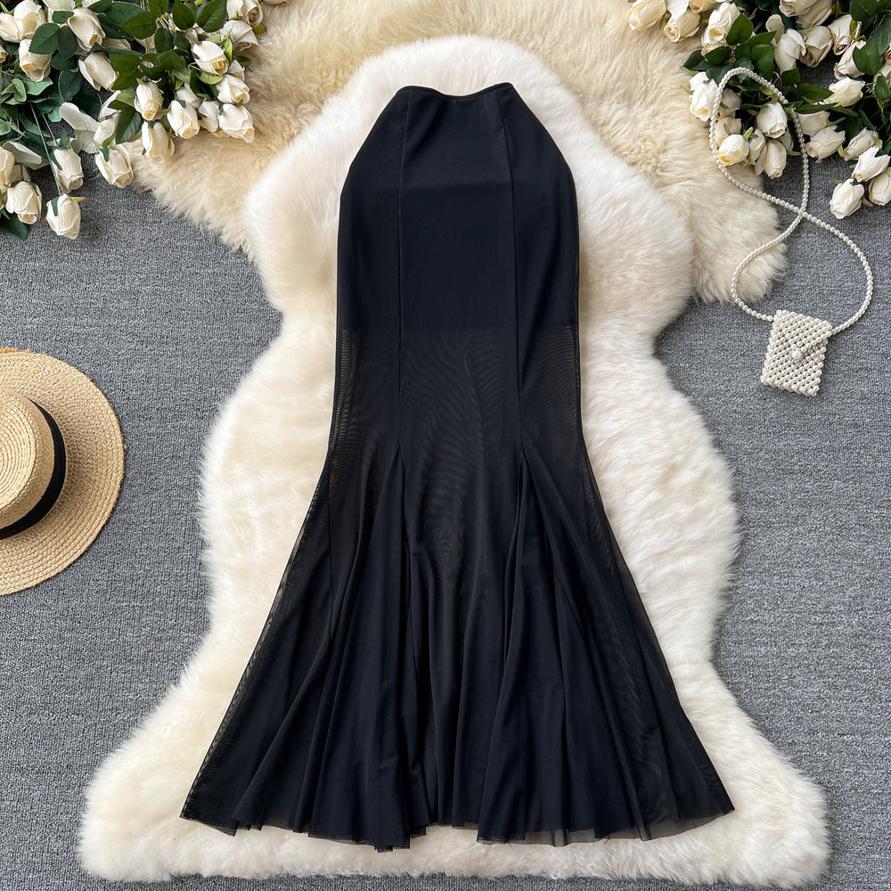 High-end, sophisticated, and effortlessly chic: this versatile midi skirt is perfect for the modern woman's commute. featuring a stylish design with elastic detailing, a figure-flattering fit, and a trendy mesh and fishtail hem, this skirt is a must-have
