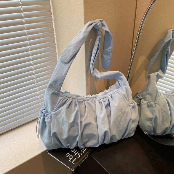 This year, the popular pleated bag 2025 new women's bag is simple and fashionable commuting trendy versatile messenger bag, shoulder underarm bag.